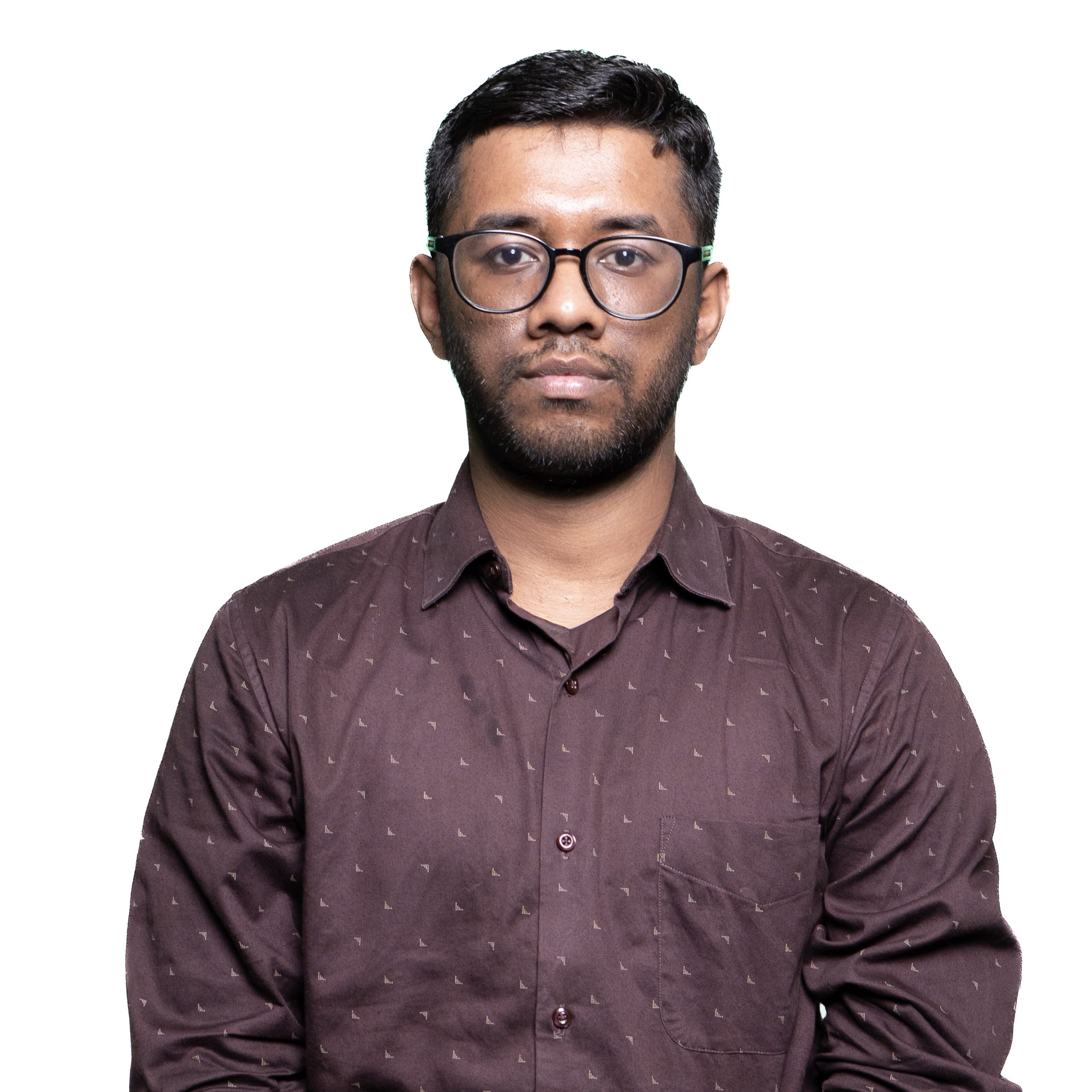 Aniket_Rawatjpg Front-facing man with short dark hair and glasses wearing a maroon patterned shirt against a white background.