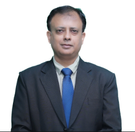 Professional portrait of a man in a dark suit and blue tie against a white background.