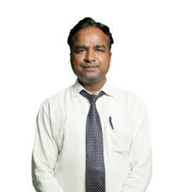 South Asian man in a pale shirt and patterned tie standing against a white background, with a pen in his shirt pocket.