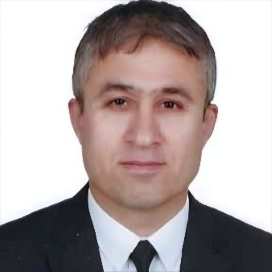 Prof. (Dr.) Ercan Ozen Head-and-shoulders portrait of a man in a dark suit and tie against a white background.