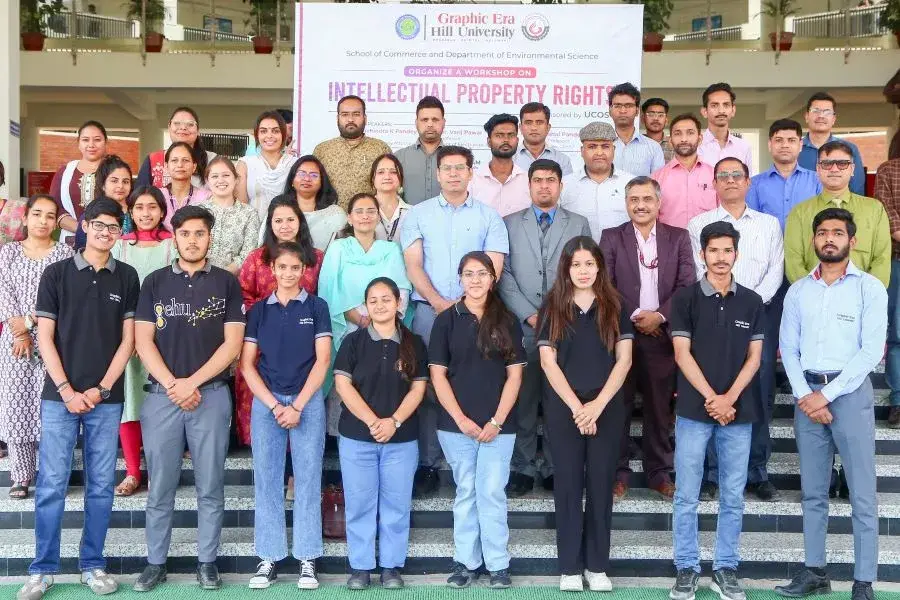 Group of students and faculty posing on steps for a workshop on Intellectual Property Rights at Graphic Era Hill University.